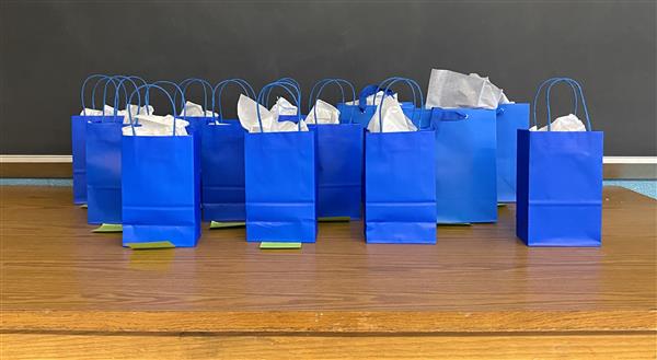  Gift cards were presented in a gift bag.